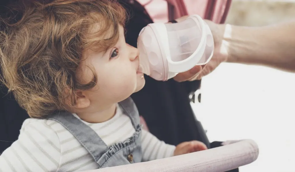 Baby drinking water from her water bottle