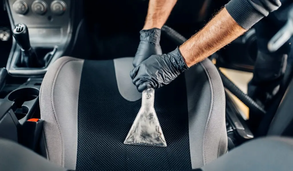 Deep cleaning of car interior with vacuum cleaner 