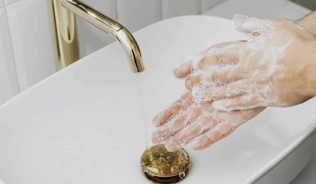 Man washing hands with soap
