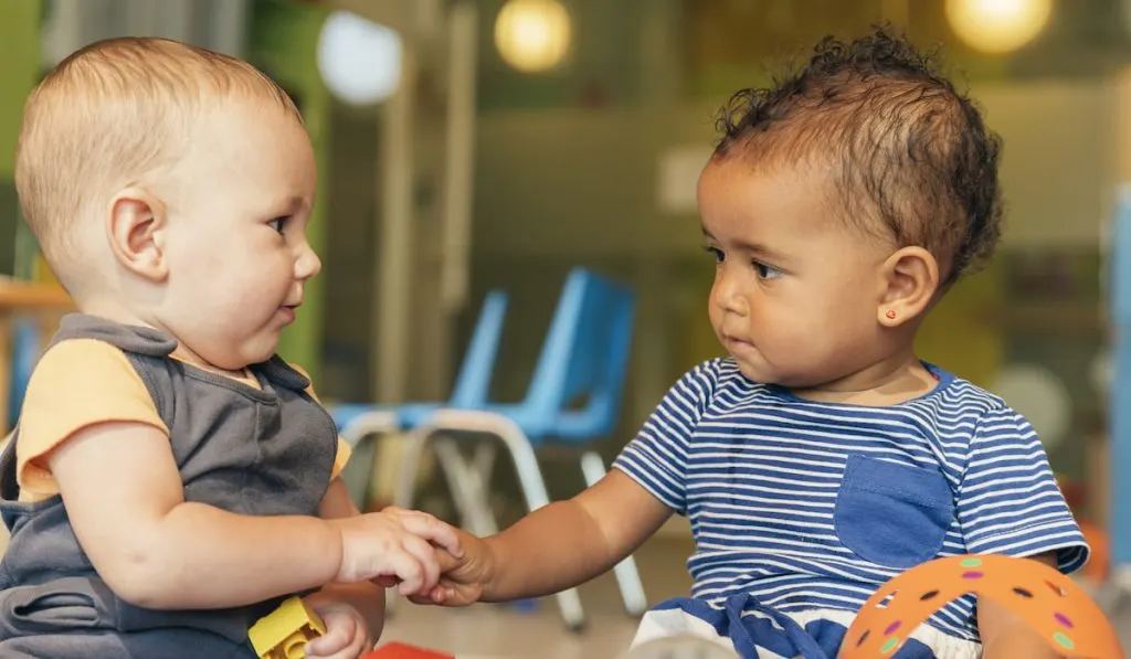 babies playing together